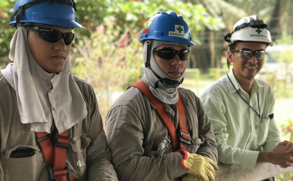 photo of men wearing protective gear