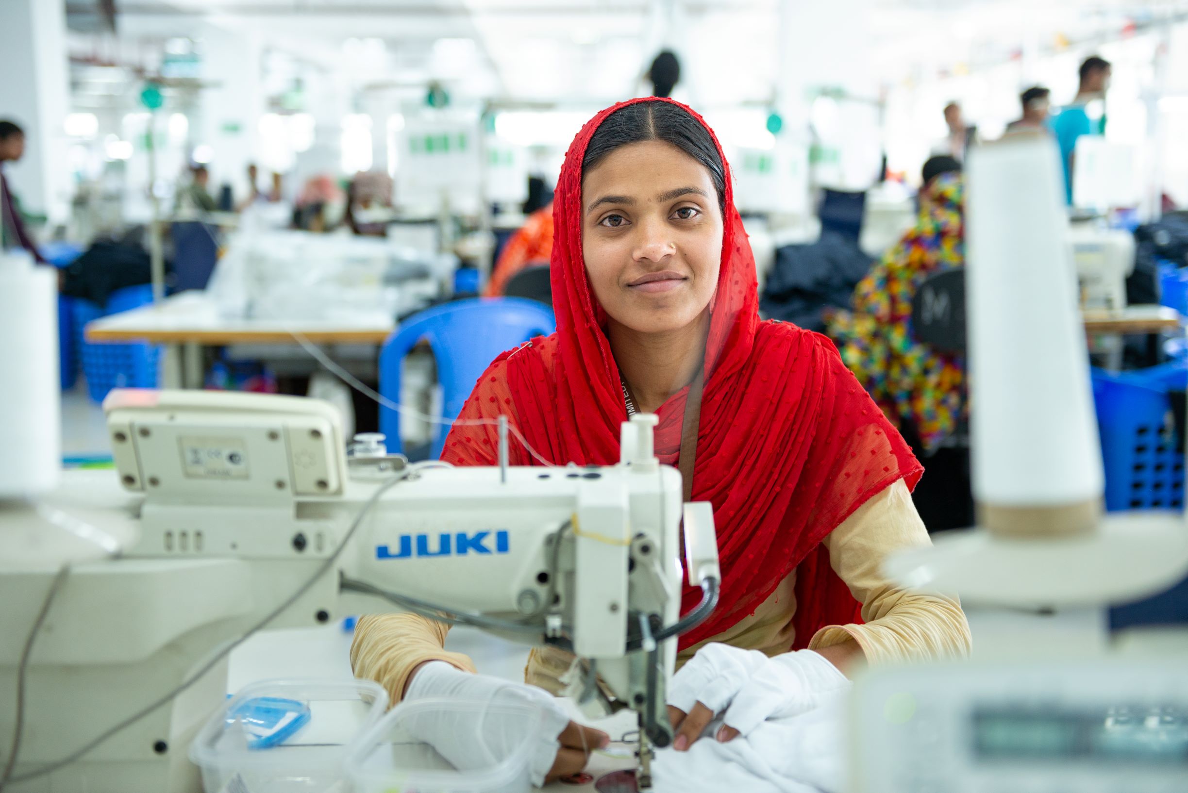 photo of woman at a sewing machine