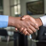 close-up photo of two people shaking hands