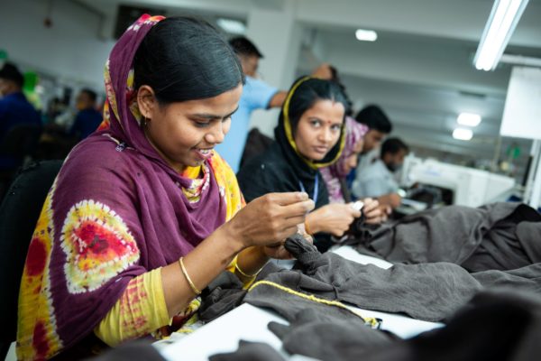 photo of women hand-sewing