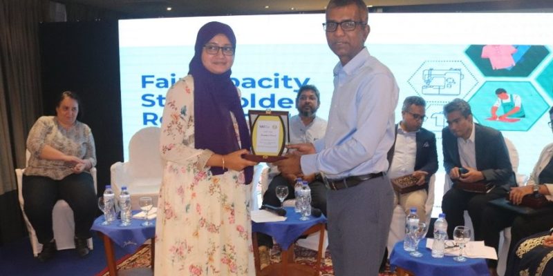 Sumaiya Shuchi, Senior CSR Specialist at Varner-Gruppen, receiving a plaque for participation in the panel discussion.