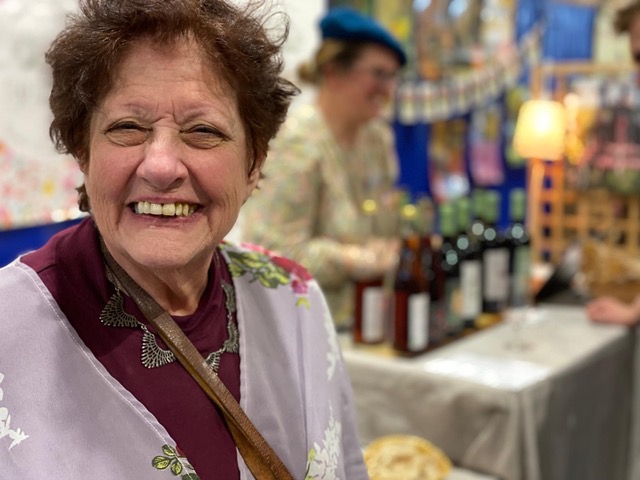 A woman smiles for the camera